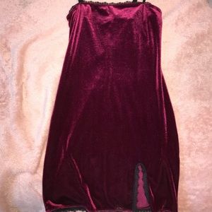 Maroon velvet mini dress with small slit.
